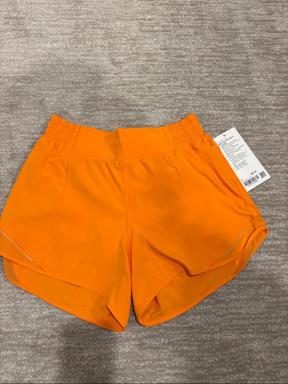 NWT Lululemon hottie hot HR short 4 inch in same lined. Size 8. Lit Orange